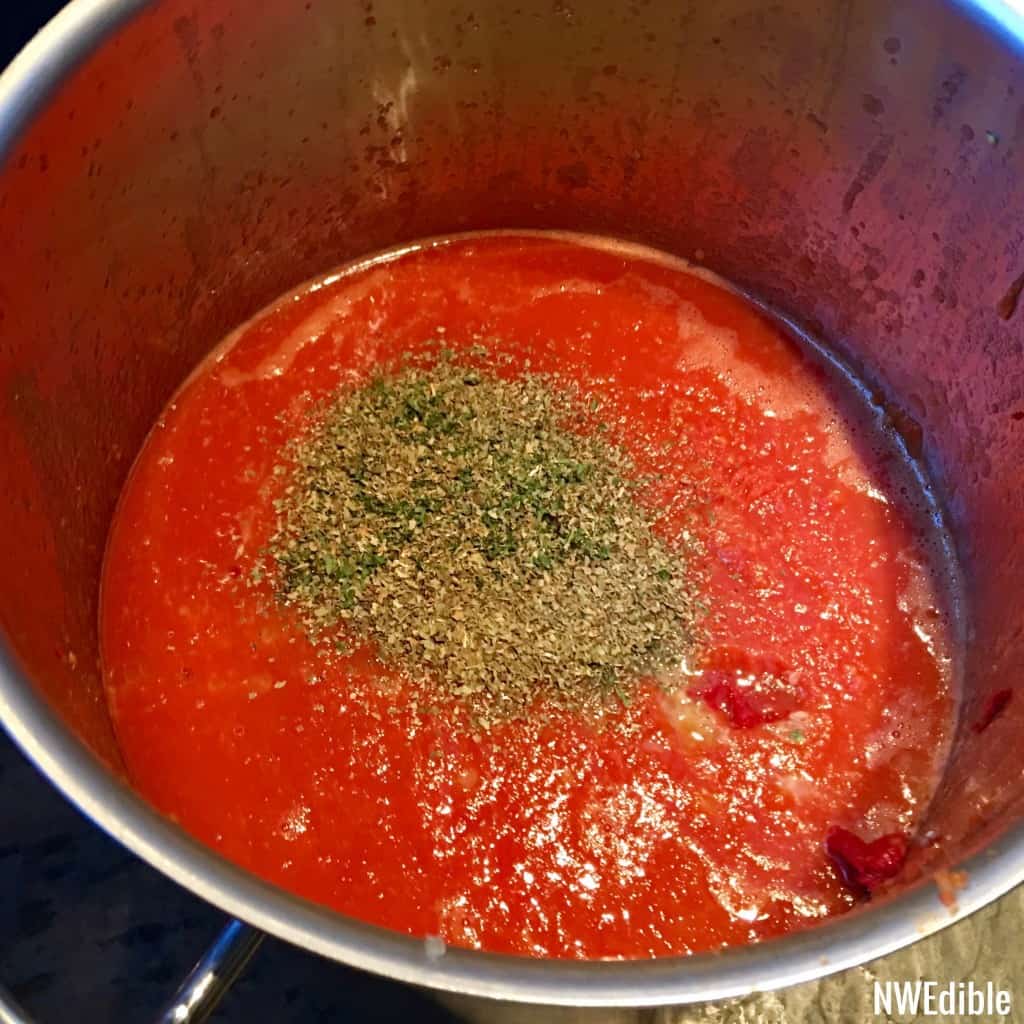 Tomato Paste and Herbs Added To Sauce